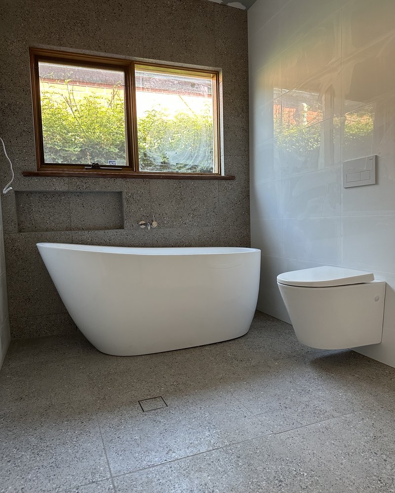 Freestanding Bath & Wall-Hung Toilet — POW Plumbing Group
